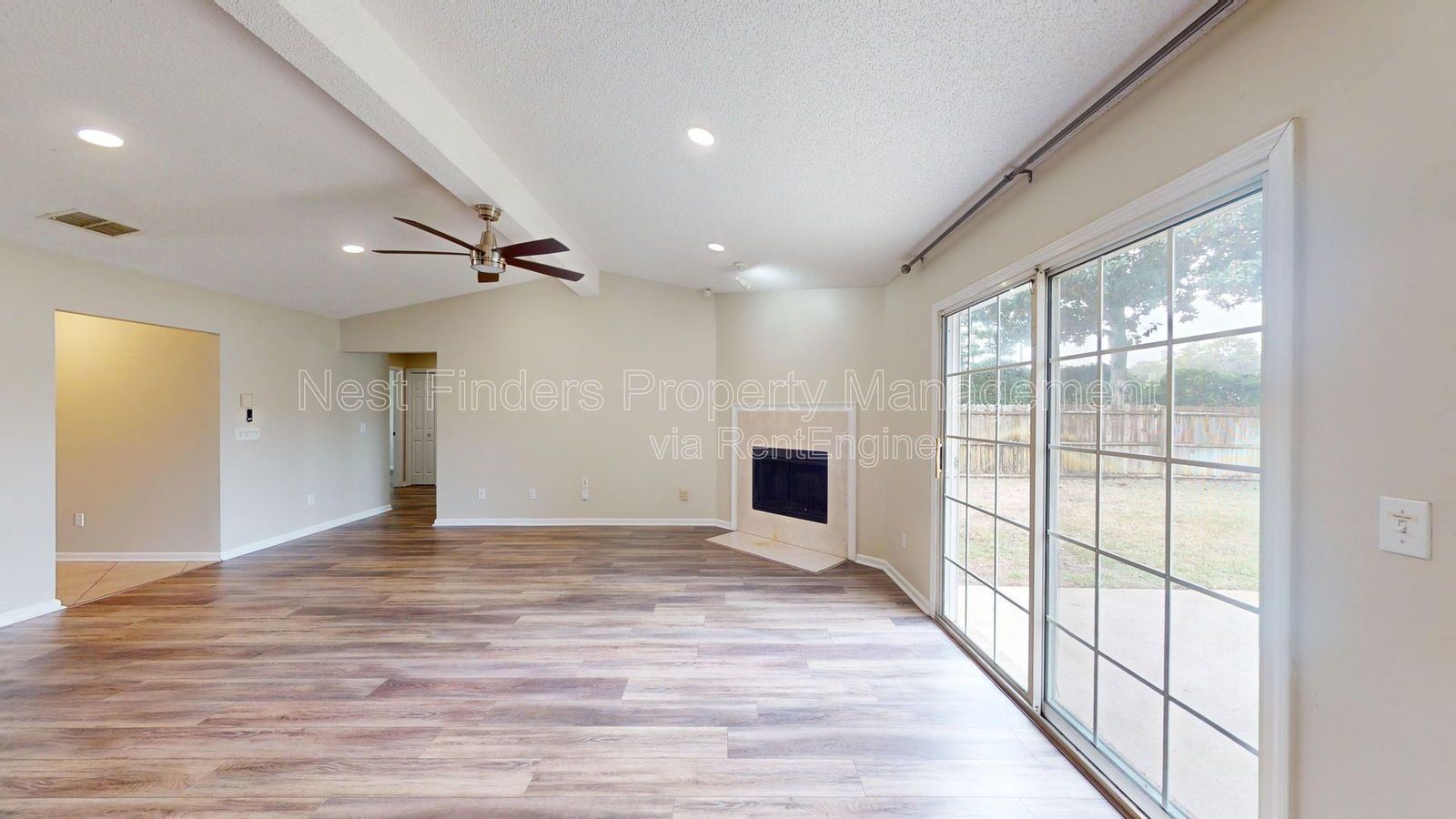 Charming 3BR/2BA corner-lot home with vaulted ceilings, fireplace, and spacious fenced yard. property image