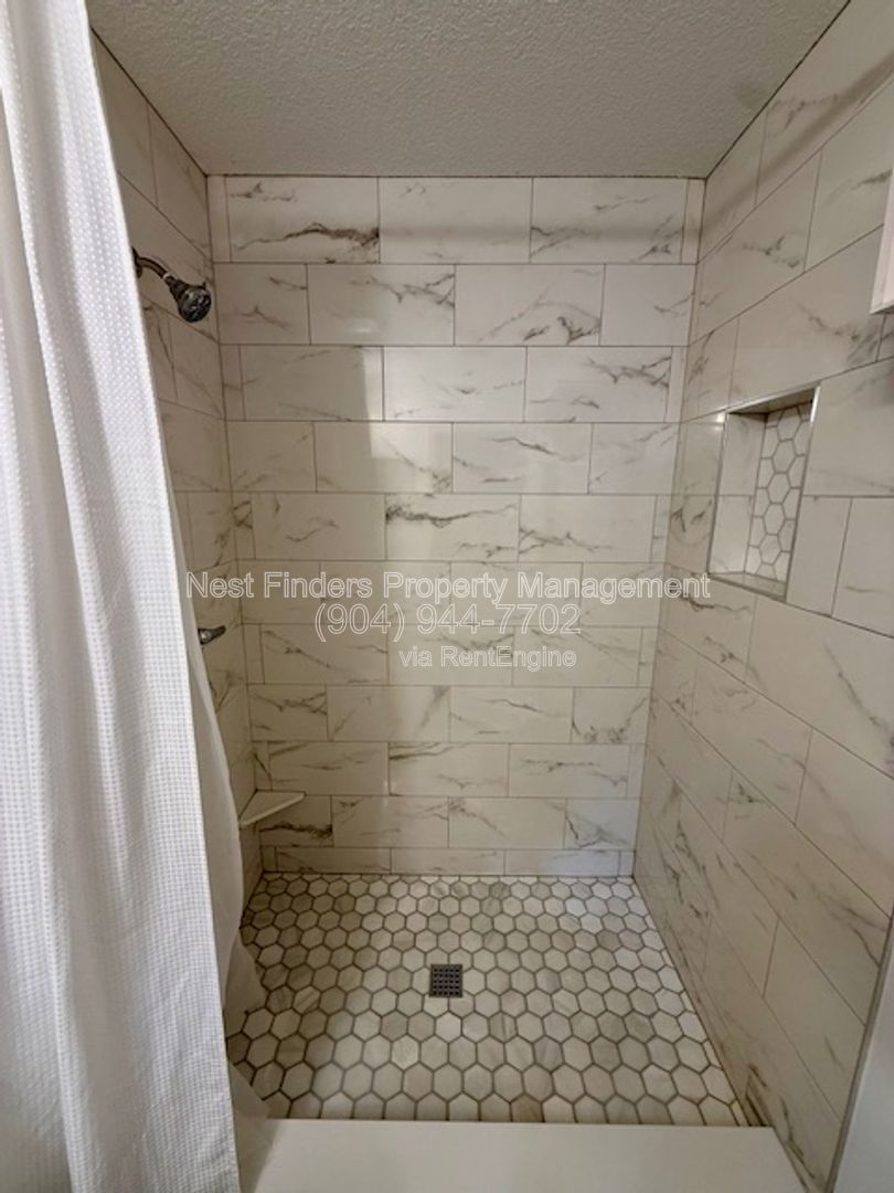 Discover the charm of this beautifully maintained 2-bedroom condominium with a private attached garage property image