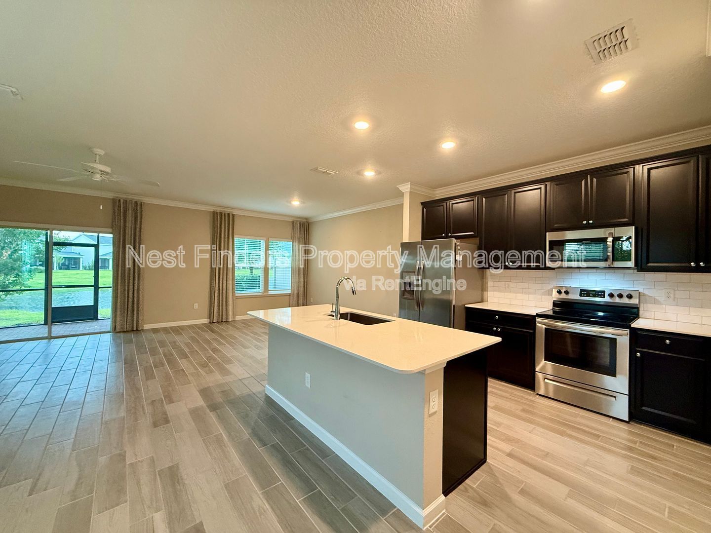 BEAUTIFUL END-UNIT TOWNHOME WITH SCREENED PATIO AND LAKE VIEWS property image
