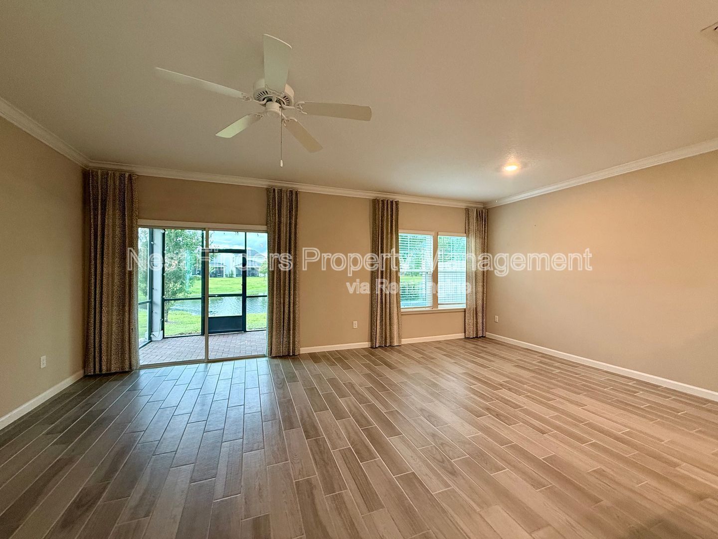 BEAUTIFUL END-UNIT TOWNHOME WITH SCREENED PATIO AND LAKE VIEWS property image