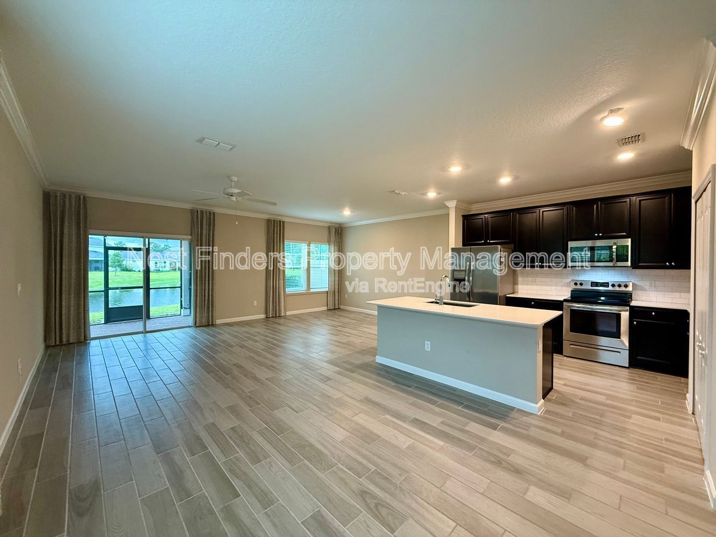 BEAUTIFUL END-UNIT TOWNHOME WITH SCREENED PATIO AND LAKE VIEWS property image