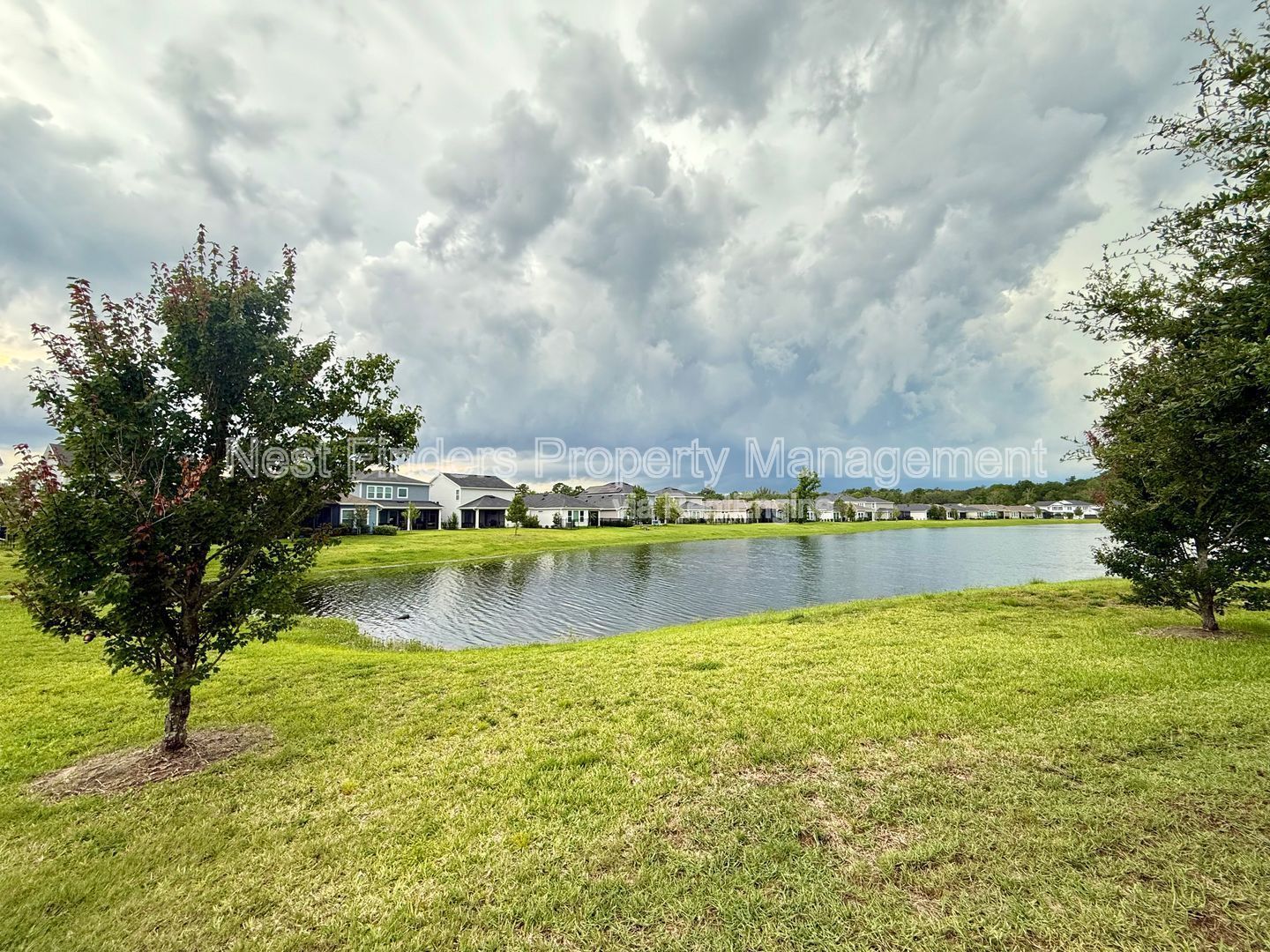 BEAUTIFUL END-UNIT TOWNHOME WITH SCREENED PATIO AND LAKE VIEWS property image