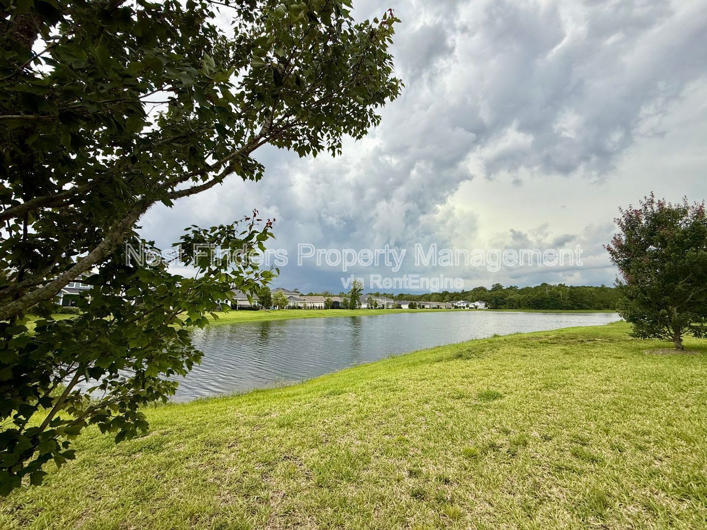 BEAUTIFUL END-UNIT TOWNHOME WITH SCREENED PATIO AND LAKE VIEWS property image