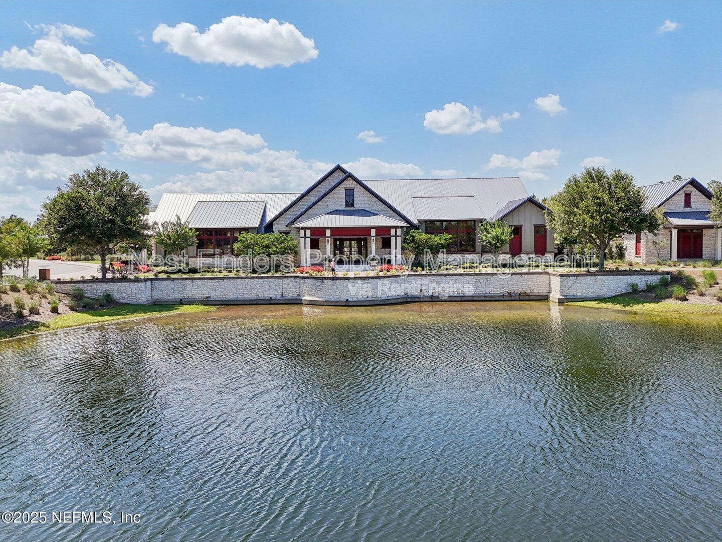 BEAUTIFUL END-UNIT TOWNHOME WITH SCREENED PATIO AND LAKE VIEWS property image